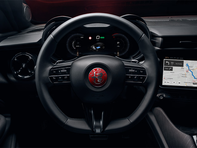 Steering wheel with red Alfa Romeo logo
